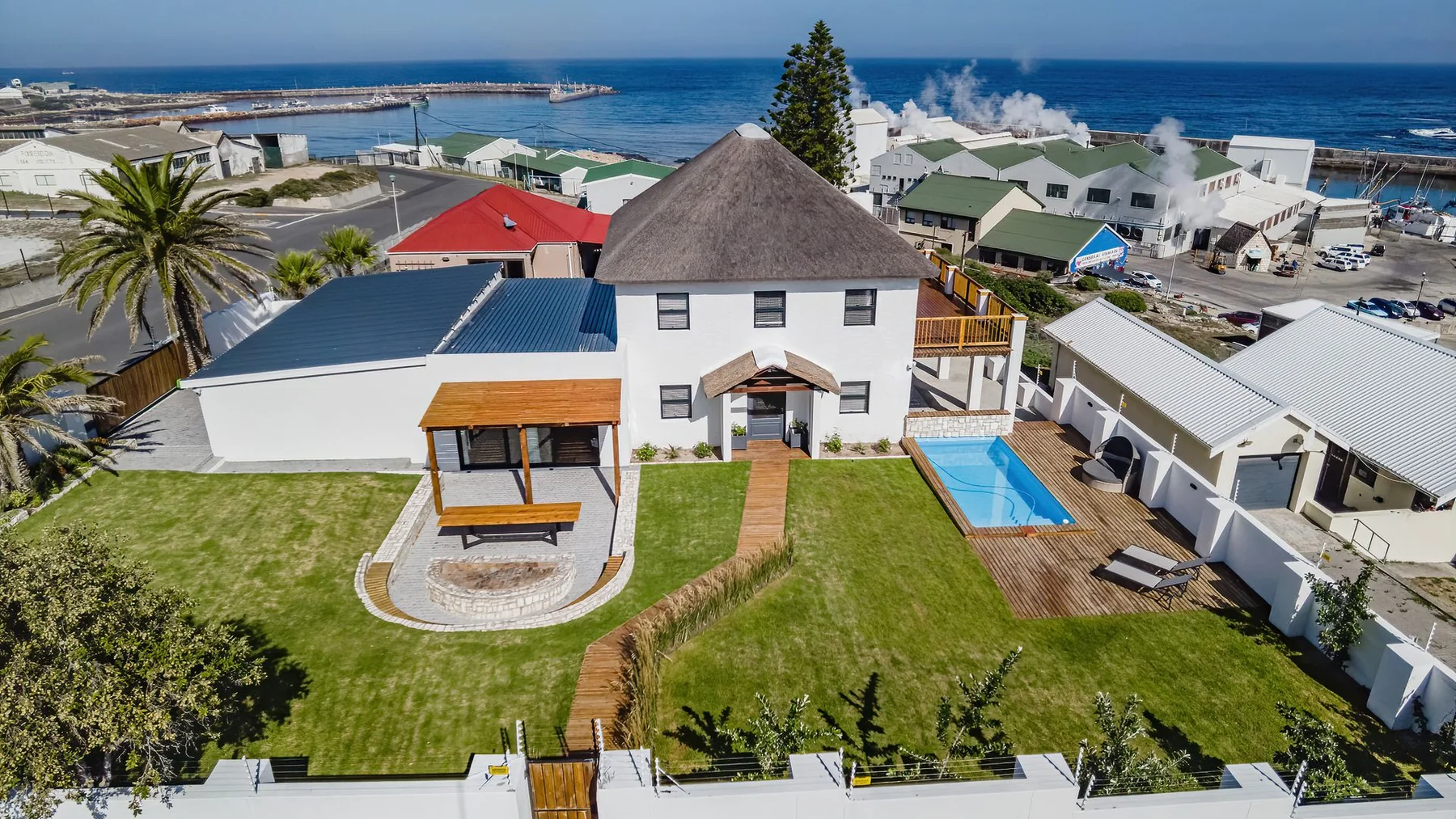 Old Harbour Place aerial view of pool and coastline
