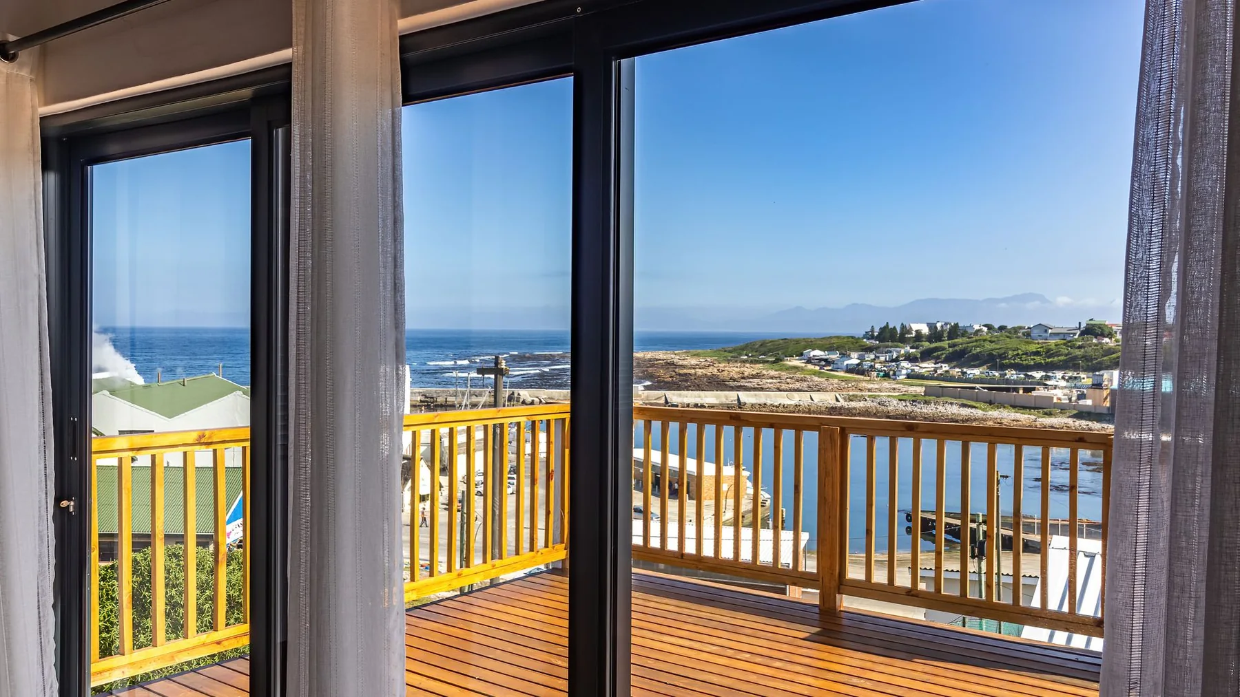 Old Harbour Place balcony and coastal view